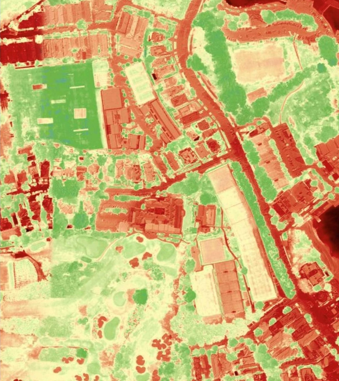 Infrared satellite imagery of the same urban area showing thermal variation across buildings and vegetation